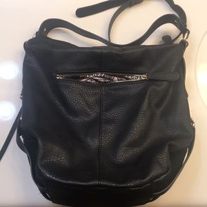 Large black purse with fun pattern inside
